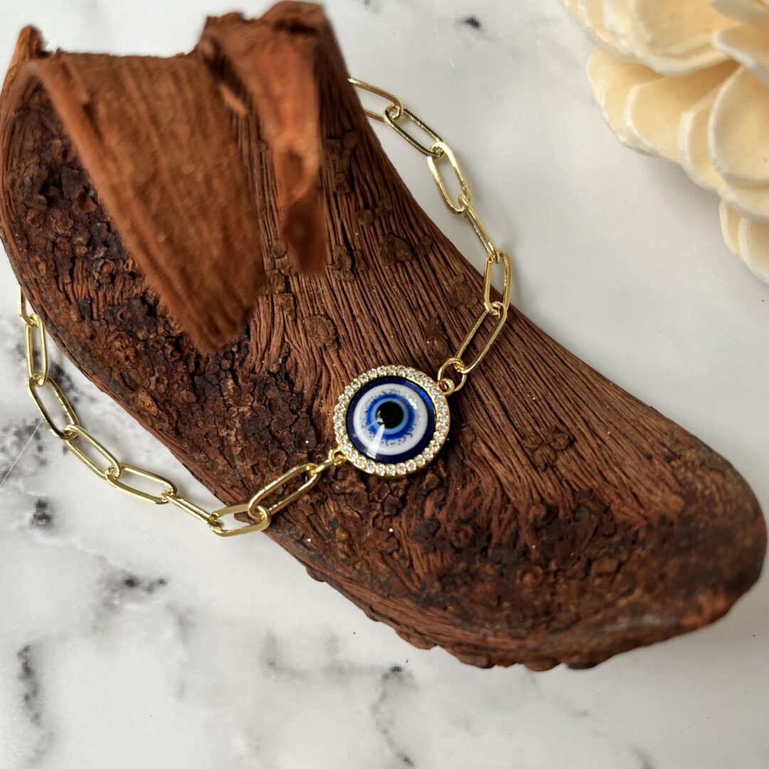 Gold chain with blue evil eye pendant