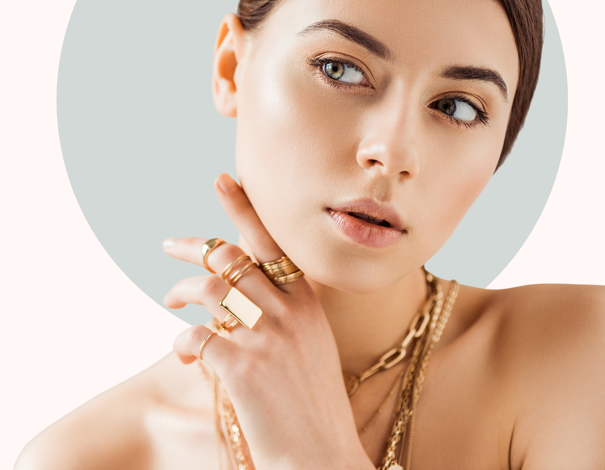 Close-up of woman adorned with gold rings