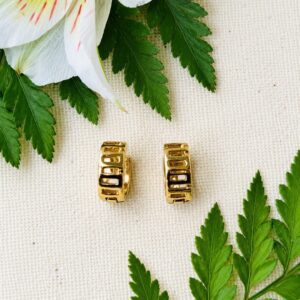 Pair of gold hoop earrings with green foliage