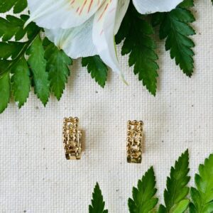 Gold hoop earrings with fern and white flower